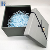 Los complementos personalizados profesionales perfuman la caja de papel gris