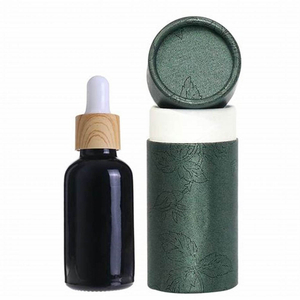 Paquete de caja de tubo redondo empaquetado en cartón cosmético personalizado de alta calidad para botella de perfume de aceite esencial